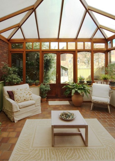 conservatory tables chairs plants room in house next to garden